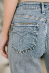 Light blue Ave Shops Elaine mid-rise boyfriend jeans with distressed details and rolled cuffs, casual denim for relaxed style.