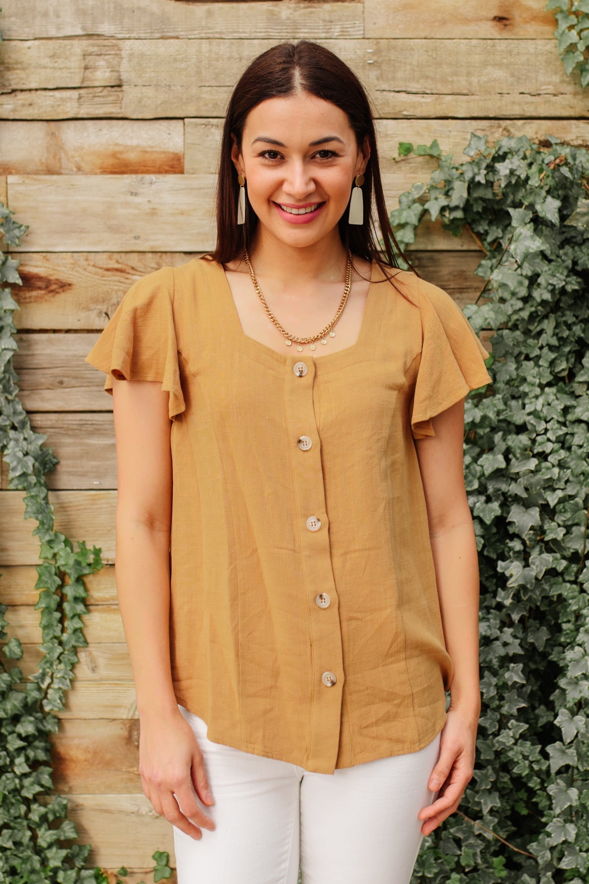 Taupe Envy Me blouse by Ave Shops, stylish long-sleeve top with a relaxed fit, shown hanging on a hanger.