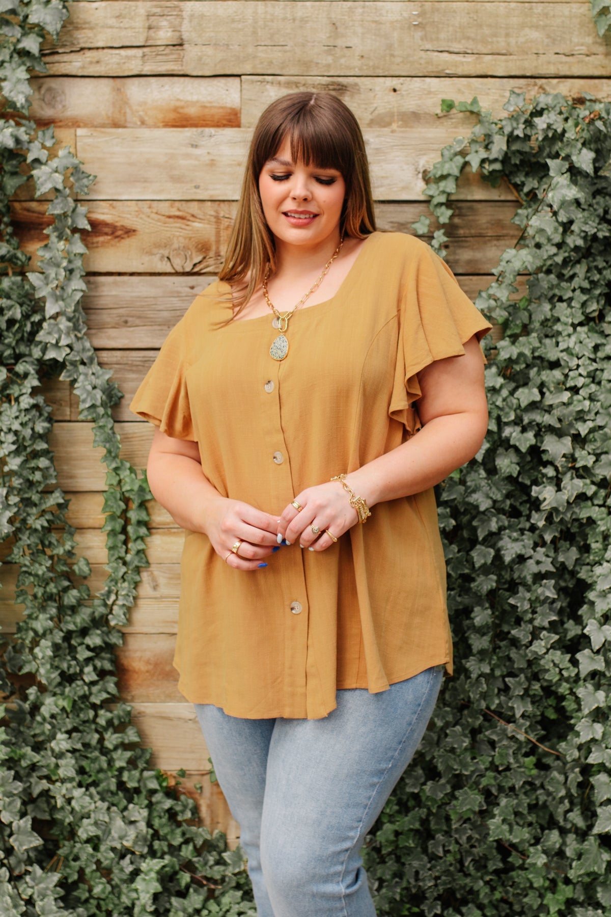 Taupe Envy Me blouse by Ave Shops, stylish long-sleeve shirt with a relaxed fit and soft fabric, displayed on a hanger.