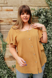 Taupe Envy Me top by Ave Shops, stylish blouse with a relaxed fit, displayed on a hanger. Perfect for casual or office wear.