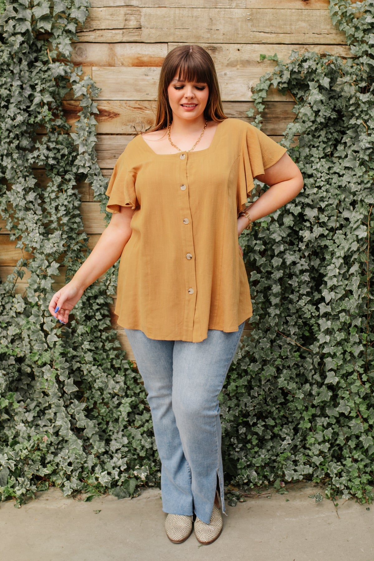 Taupe Envy Me blouse from Ave Shops, stylish and comfortable shirt with a relaxed fit, shown on a hanger.