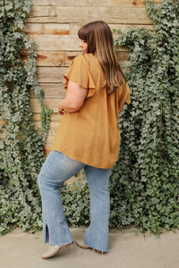 Taupe Envy Me blouse from Ave Shops featuring a stylish, fitted design with long sleeves and a V-neck neckline.