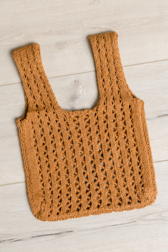 Tan girls' open weave handbag with a stylish design, perfect for casual and day outings.