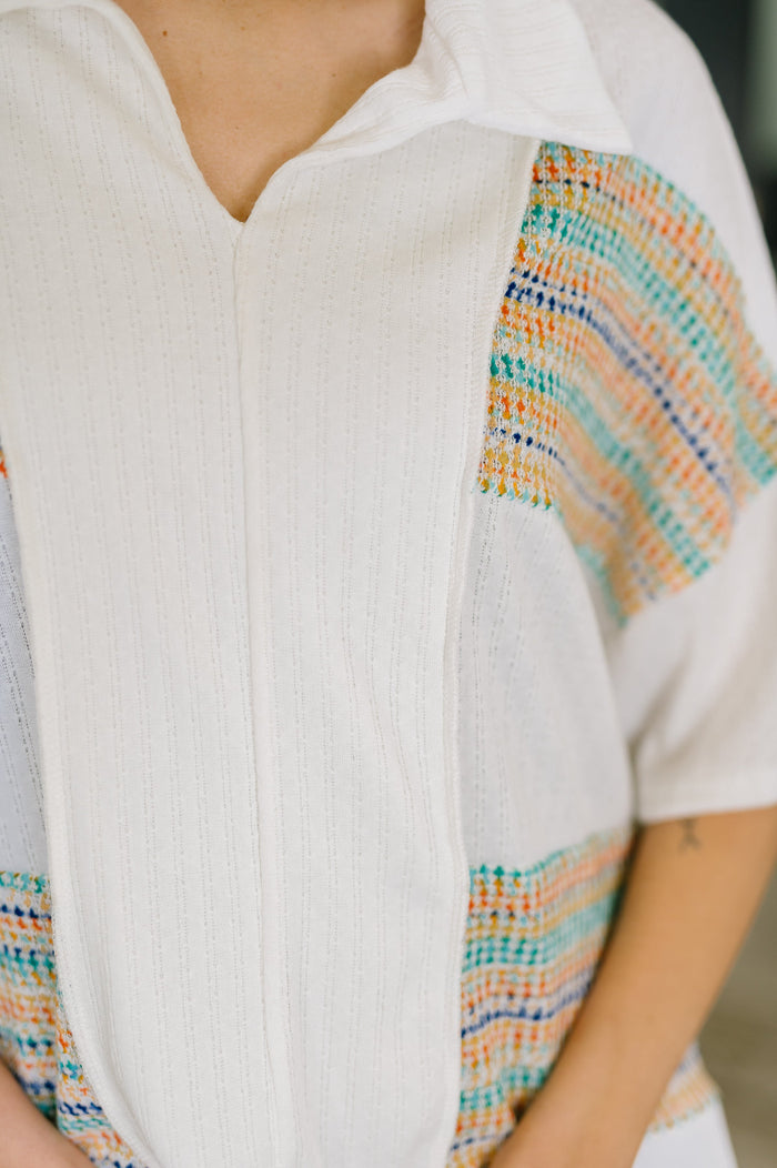 Cream-colored collared knit top from Ave Shops, styled as a casual blouse with a relaxed fit and button-up front.