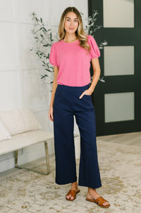 Fuchsia balloon sleeve blouse by Grace & Virtue, featuring puffed sleeves and a relaxed fit, styled for a casual look.