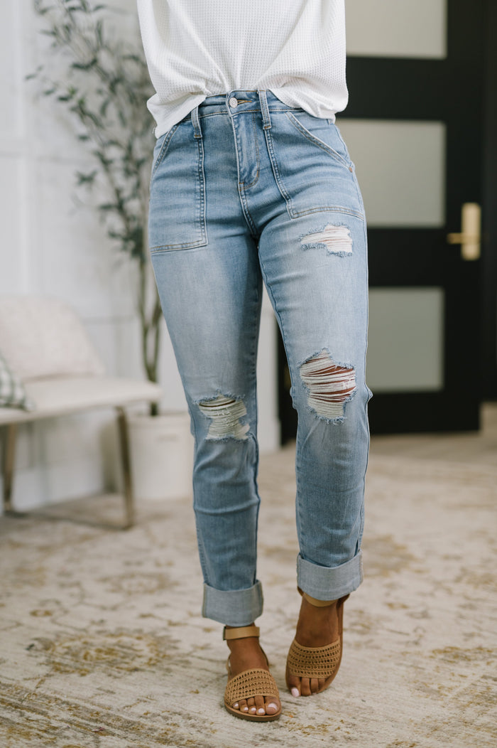 Aiden high rise boyfriend jeans with distressed details and patch pockets, featuring a relaxed fit from Ave Shops.