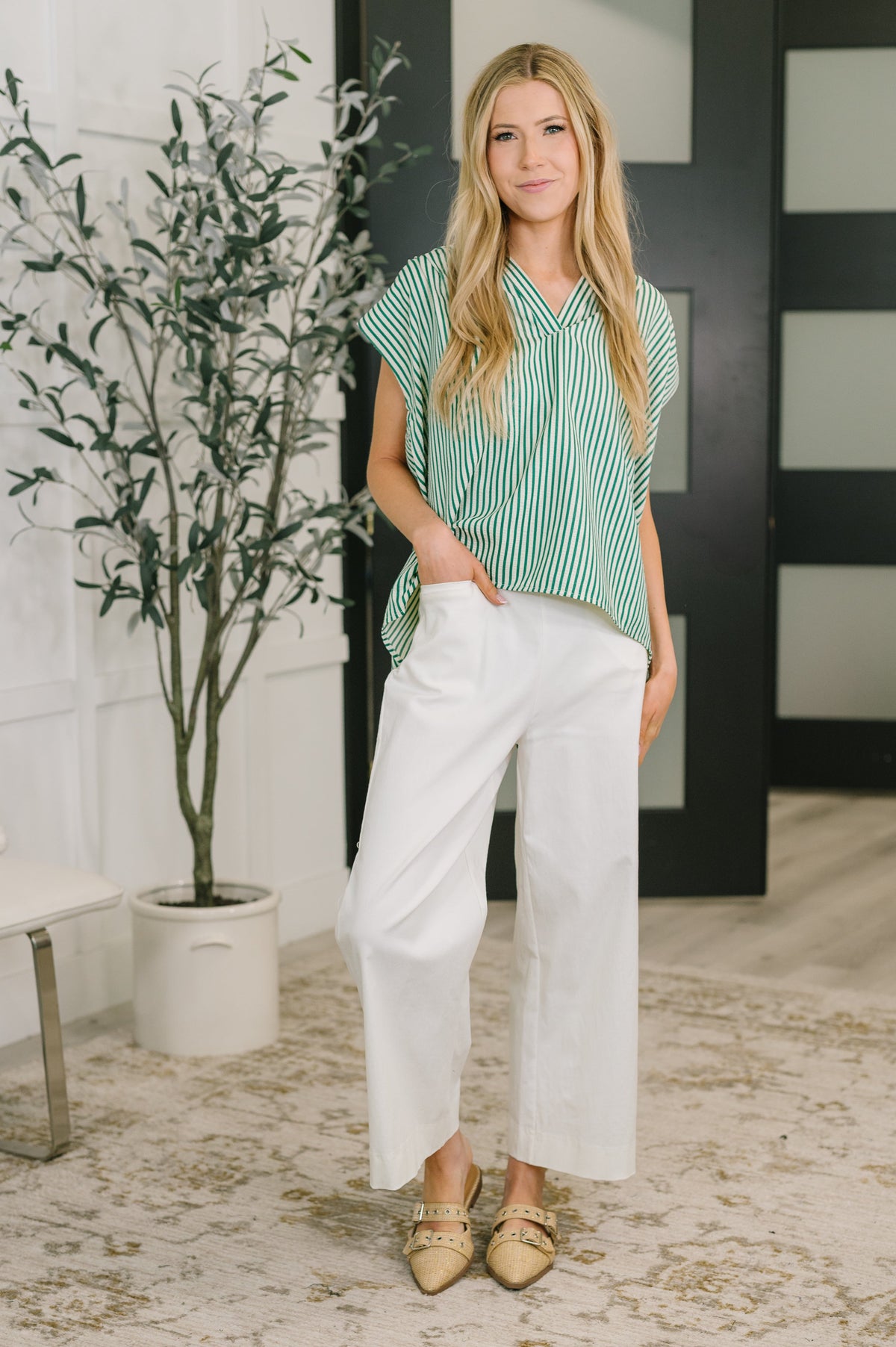 Green sleeveless V-neck blouse for women by Ave Shops, featuring a stylish and comfortable design.