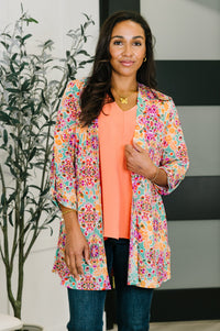Pink and orange floral abstract Lizzy cardigan by Ave Shops, featuring a stylish, lightweight knit with long sleeves and open front design.