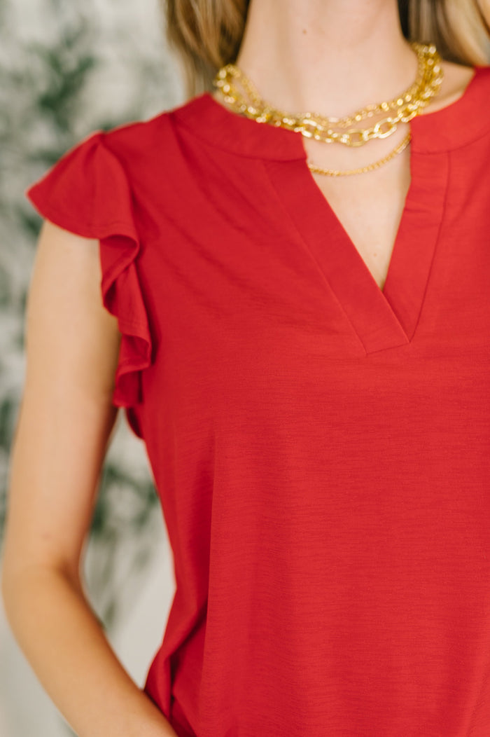 Red Lizzy flutter sleeve V-neck blouse by Ave Shops, showcasing the relaxed fit and stylish design on a mannequin.