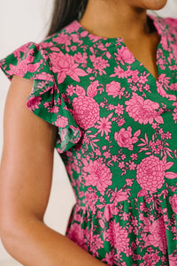 Green and pink floral Lizzy Forever flutter sleeve dress by Ave Shops, showcasing a feminine, flowy design with floral patterns.