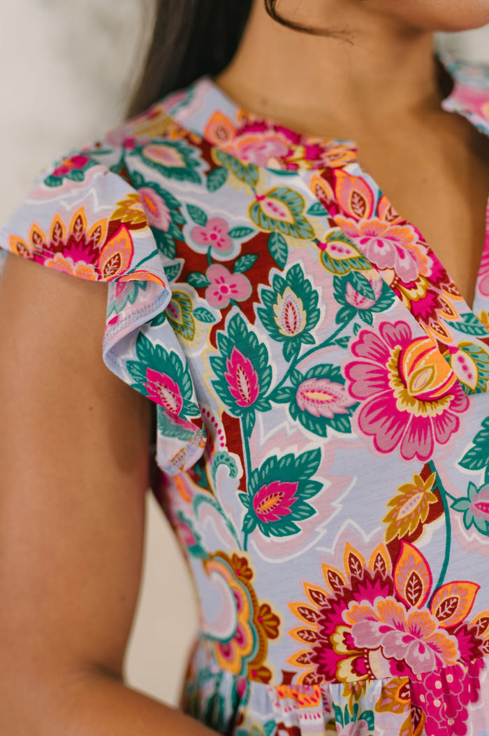 White multi-floral paisley Lizzy Forever flutter sleeve dress by Ave Shops, showcasing its lightweight fabric and feminine design.