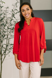 Red Lizzy top blouse from Ave Shops featuring a stylish, fitted design with long sleeves and a round neckline.
