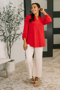 Red Lizzy blouse by Ave Shops featuring a stylish, fitted design with long sleeves and a classic collar.