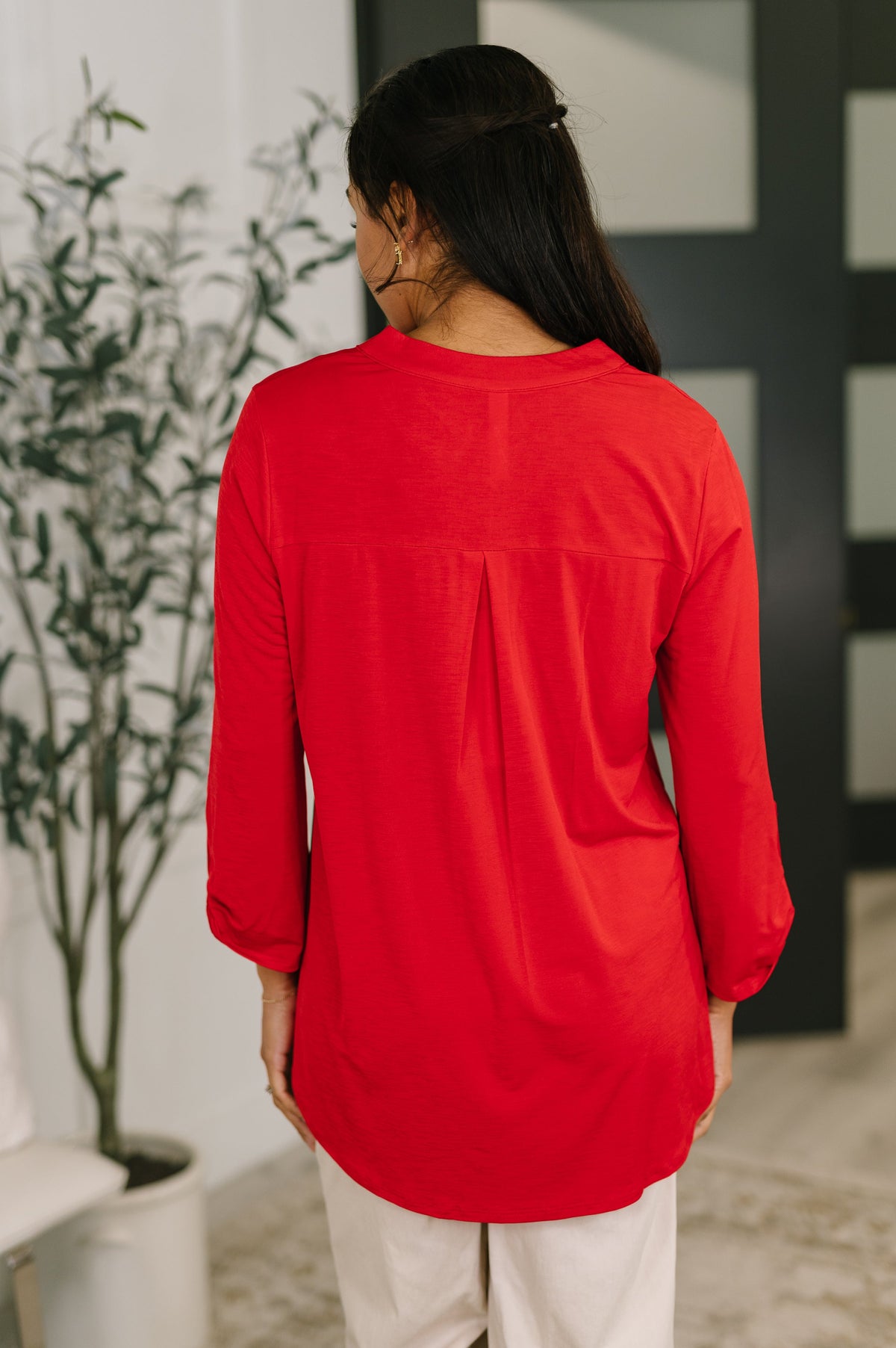 Red Lizzy Top blouse by Ave Shops featuring a stylish design, with long sleeves and a fitted silhouette.