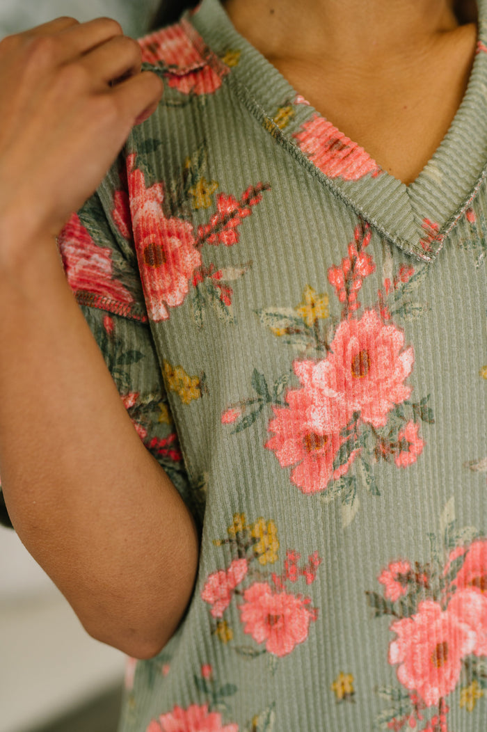 Floral V-neck blouse from Ave Shops featuring a colorful butterfly and flower print, long sleeves, and a relaxed fit.