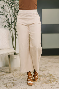 High-waisted wide-leg linen pants by Ave Shops, featuring relaxed fit and natural fabric, displayed on a white background.