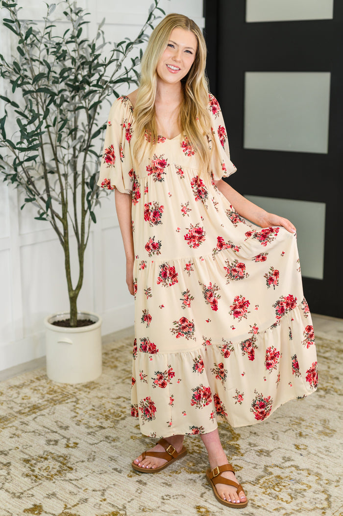 Petals & Postcards balloon sleeve dress by Ave Shops, featuring floral details and airy balloon sleeves, displayed on a hanger.