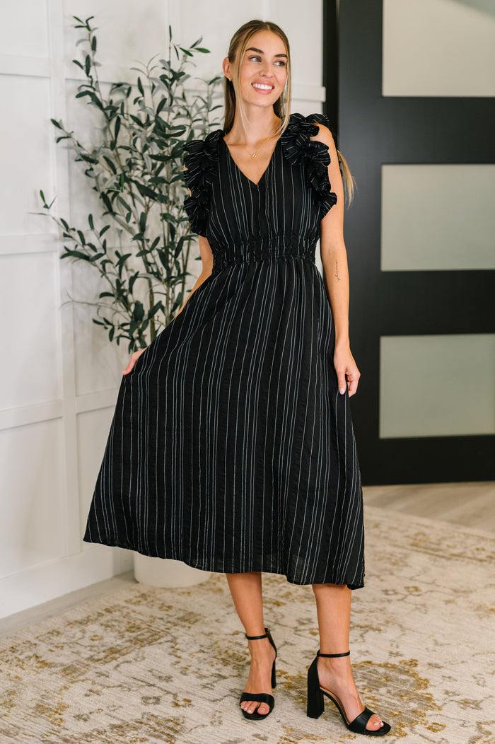 Black pinstripe V-neck dress with ruffle sleeves from Ave Shops, featuring a stylish and elegant design perfect for various occasions.