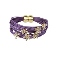 Leather flower charm string bracelet by SAACHI with colorful floral accents and adjustable strap on a white background.