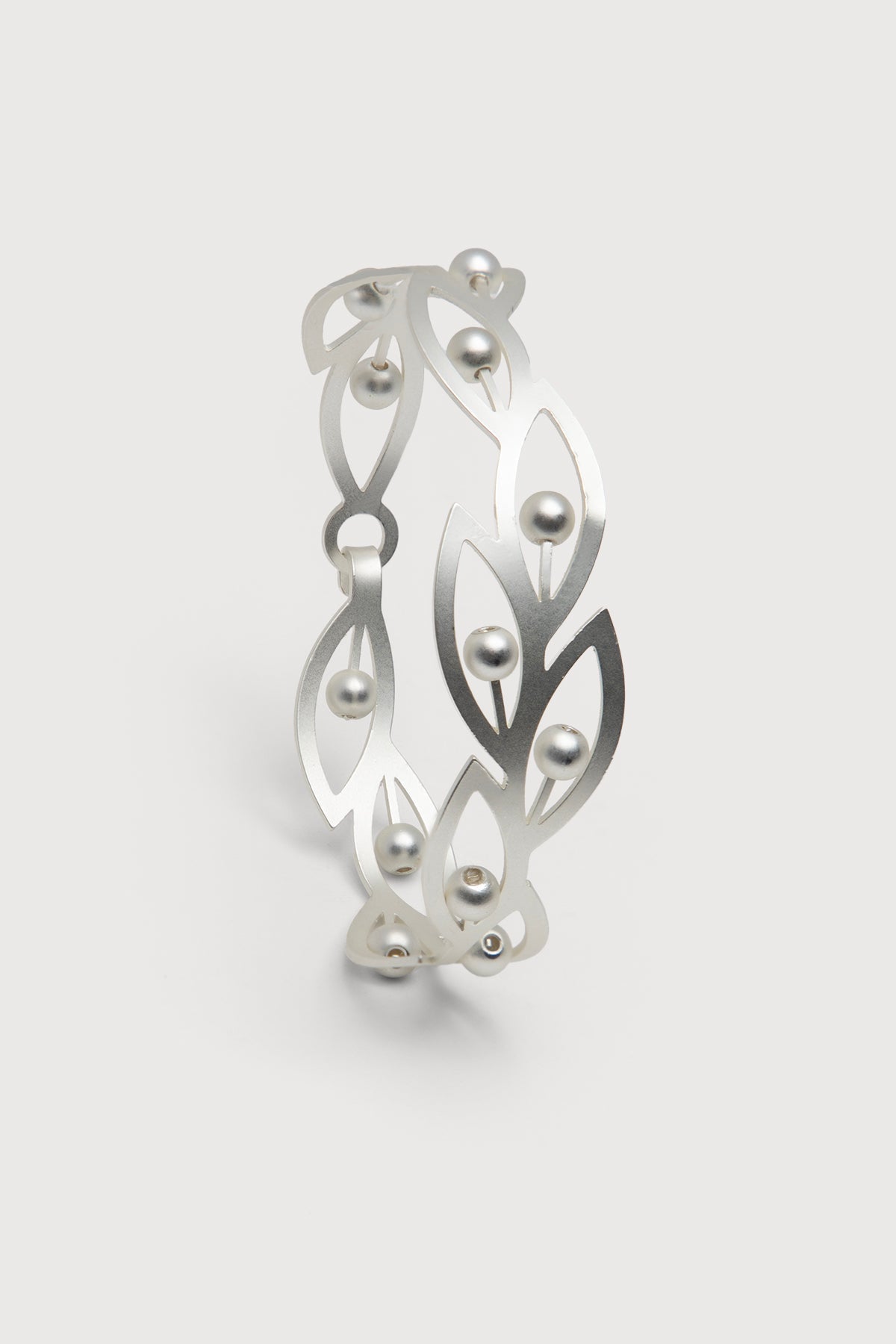 Beaded botanical hook bracelet by SAACHI featuring colorful beads and intricate floral design on a delicate bracelet chain.