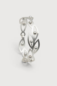 Beaded botanical hook bracelet by SAACHI featuring colorful beads and intricate floral design on a delicate bracelet chain.