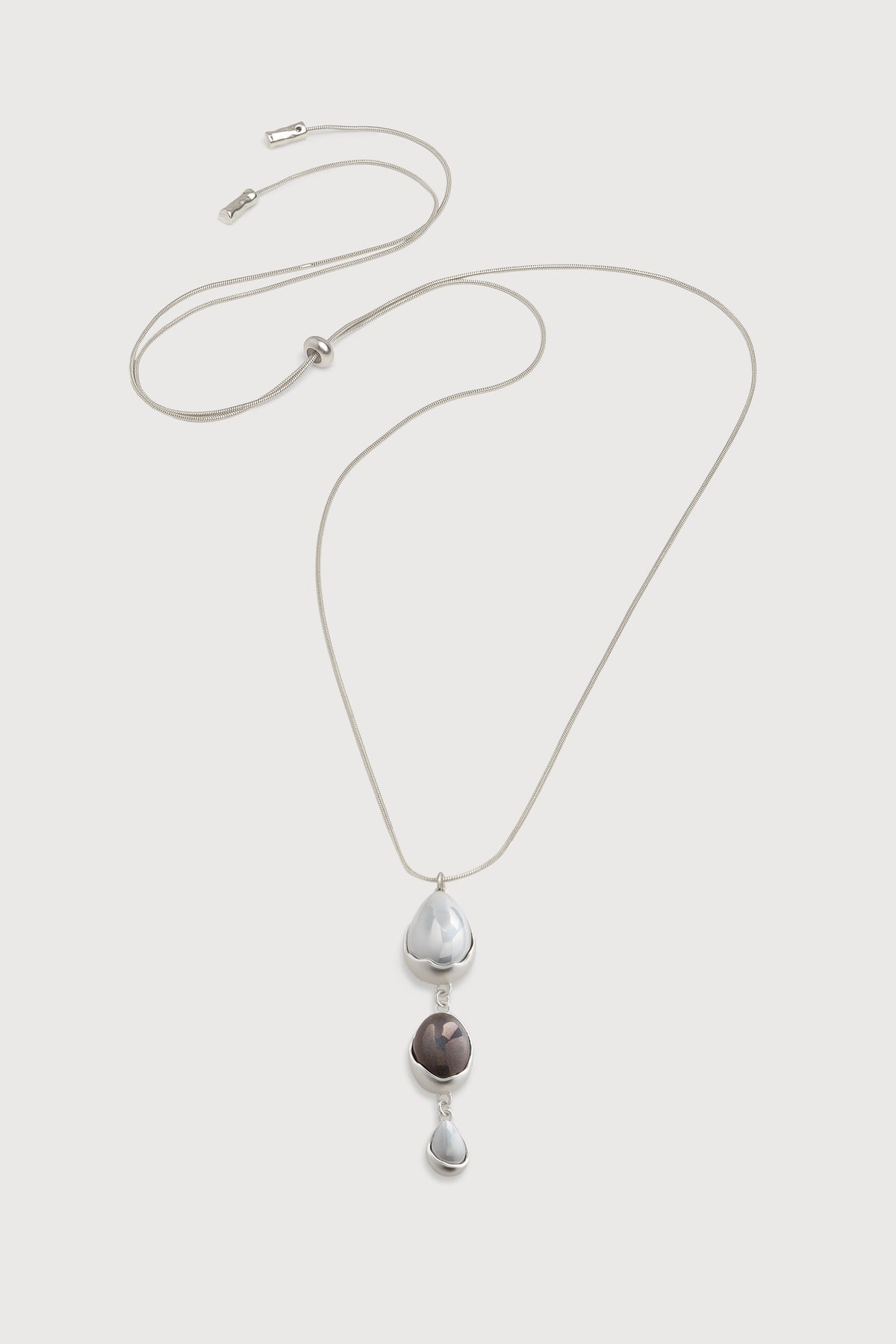 SAACHI gemstone triple glass orb dangle necklace featuring three hanging glass orbs on a delicate chain.