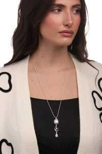 SAACHI triple glass orb gemstone necklace with dangling spheres, showcasing elegant, colorful gemstone accents on a delicate chain.