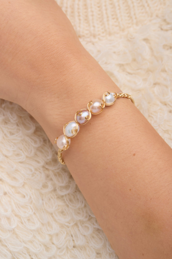 SAACHI freshwater pearl bracelet cuff with elegant white pearls and silver accents, perfect for stylish jewelry collection.