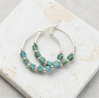 Silver and turquoise beaded hoop earrings from Bijou by SAM featuring boho-style silver and turquoise jewelry.