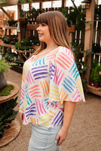 Black Stamped By Love blouse from Ave Shops, featuring a stylish stamped pattern and relaxed fit, perfect for casual or office wear.