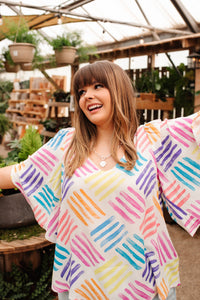 White blouse from Ave Shops' Stamped By Love Top collection, featuring a stylish stamped design and button-up front.