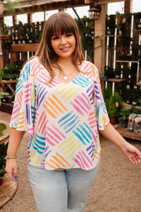 Printed Stamped By Love blouse by Ave Shops, stylish women’s top with unique stamped design, casual and comfortable fit.