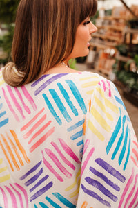 Light blue stamped blouse from Ave Shops featuring a relaxed fit with button-up front and long sleeves, casual stylish top.