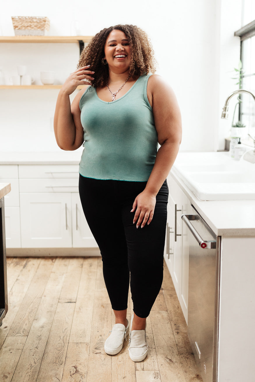 Aqua blue Stay Easy Tank blouse from Ave Shops, casual sleeveless top with a relaxed fit, displayed on a hanger.