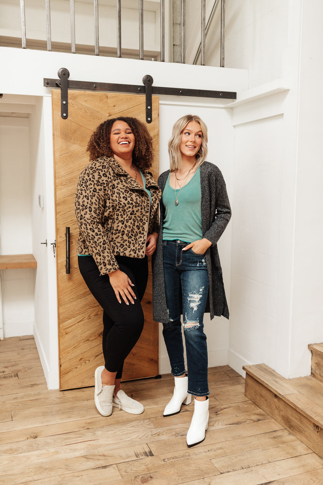 Aqua blue Stay Easy Tank blouse from Ave Shops, featuring a sleeveless design and lightweight fabric, hanging on a hanger.