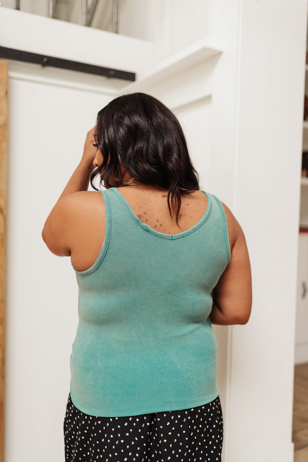 Aqua Stay Easy tank top by Ave Shops, sleeveless blouse with a relaxed fit, displayed on a hanger.