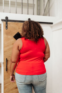 Red Stay Easy tank top from Ave Shops, styled as a casual blouse with a sleeveless design and relaxed fit.