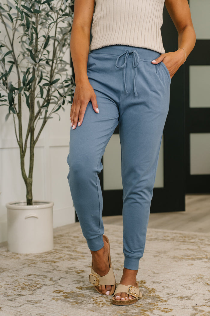 Dusty blue high-waisted joggers by Ave Shops, featuring a comfortable fit and casual style, shown on a model.