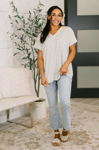 Light pink You Just Get It V-Neck Top by Ave Shops, casual blouse with a V-neck and short sleeves, laid flat.