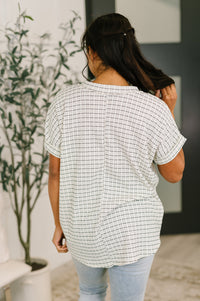 Light blue You Just Get It V-Neck Top by Ave Shops, shown on a hanger, featuring a soft V-neck and relaxed fit blouse.