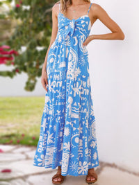 Tie-front print maxi dress from Trendsi featuring a flowy silhouette, vibrant patterns, and a stylish front knot detail.