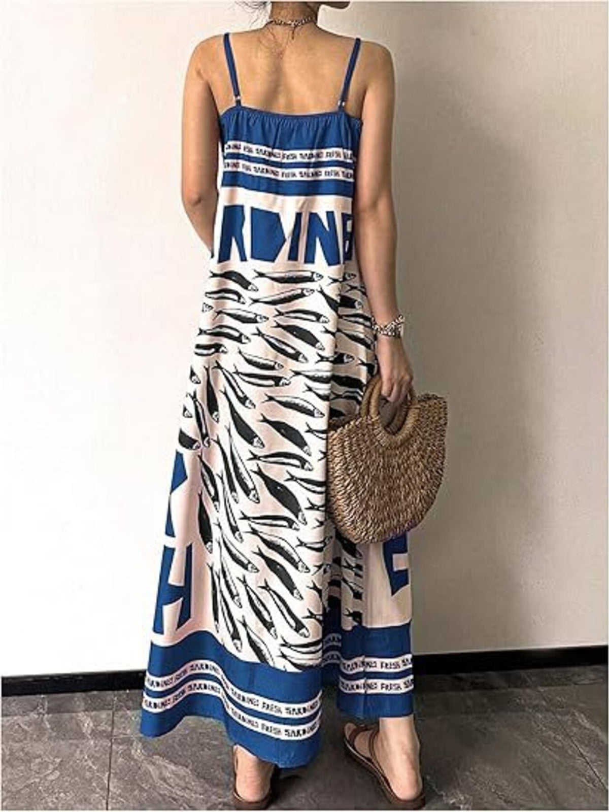 Sardine print spaghetti strap maxi dress from Trendsi, featuring a flowing silhouette and vibrant fish pattern.