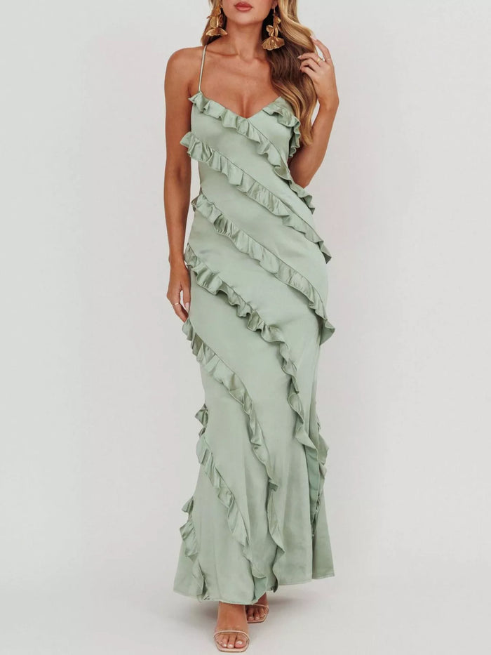 Elegant ruffled spaghetti strap maxi dress by Trendsi featuring flowing fabric and a stylish design, perfect for summer or special occasions.