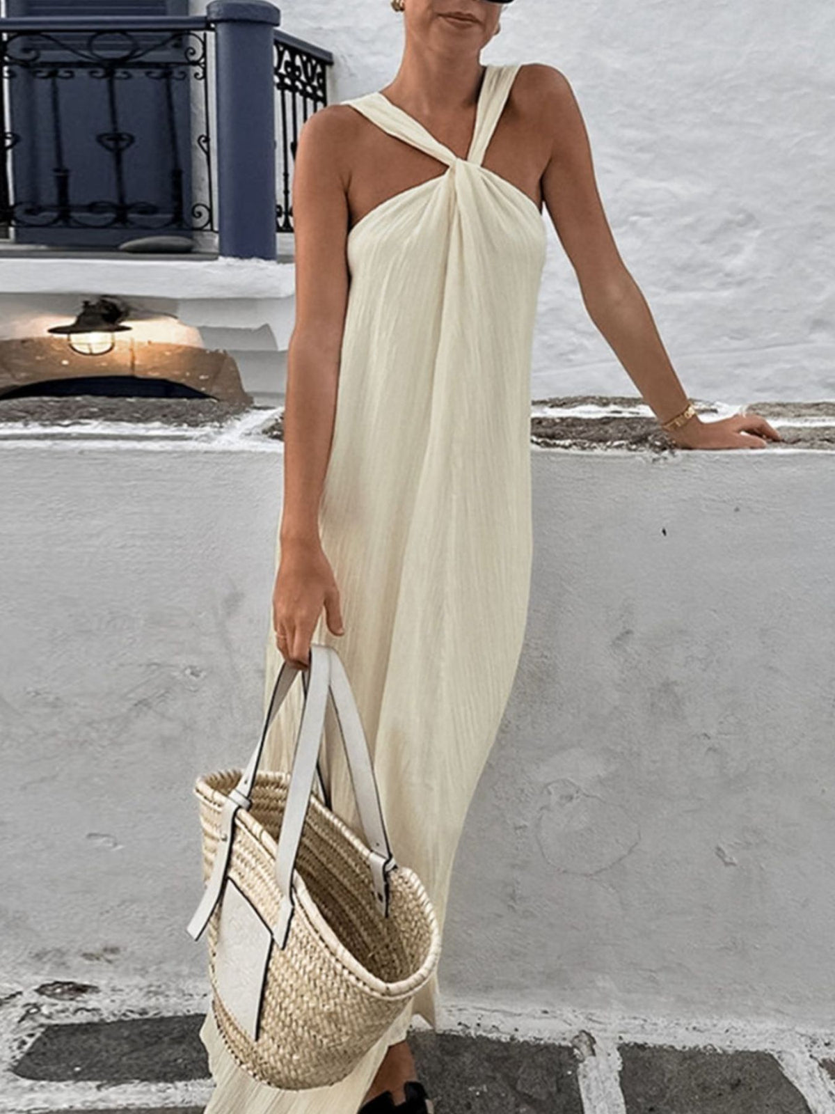 Elegant black halter neck maxi dress from Trendsi, flowing fabric with a fitted bodice and open back for a stylish summer look.