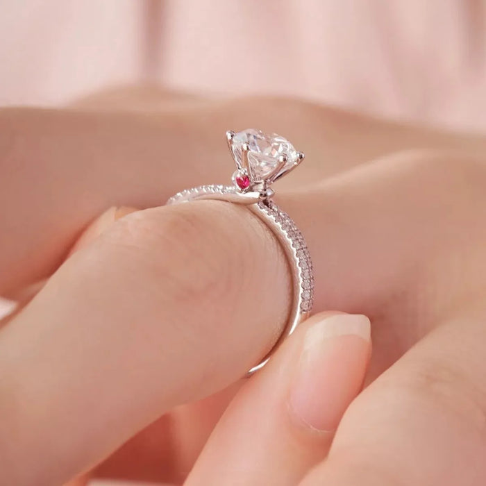 Sterling silver moissanite ring with 1-carat center stone, featuring a sleek and elegant design, perfect for special occasions.