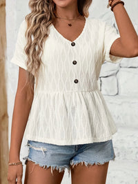 Decorative button V-neck blouse from Trendsi featuring a stylish design and lightweight fabric, perfect for casual or workwear.