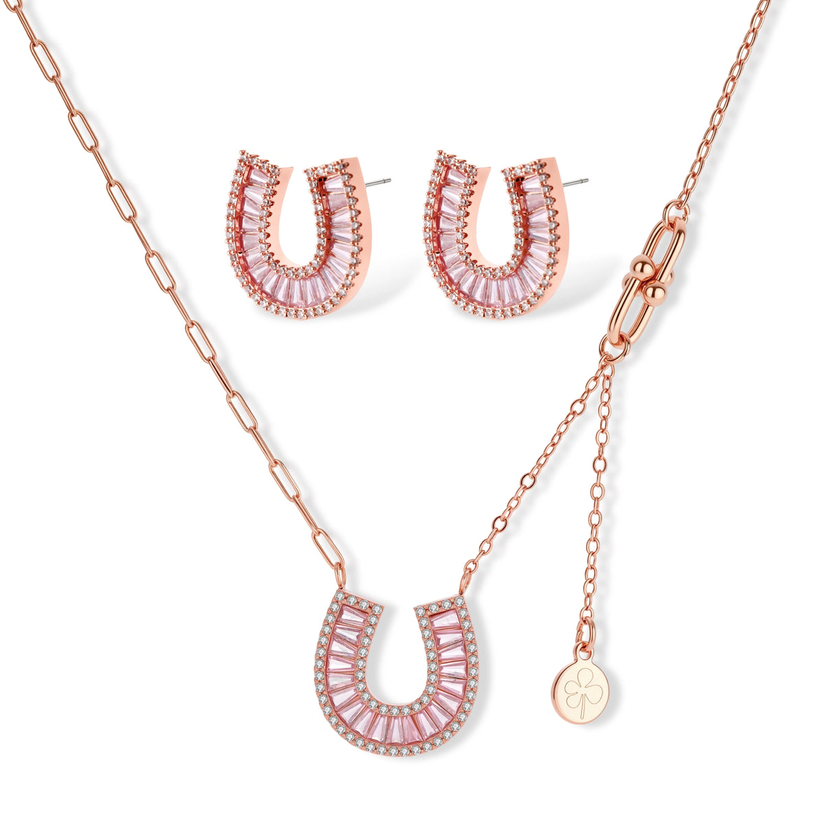 Sparkling horseshoe-shaped jewelry set with AAA cubic zirconia in gold-plated and white gold finishes on cream background.