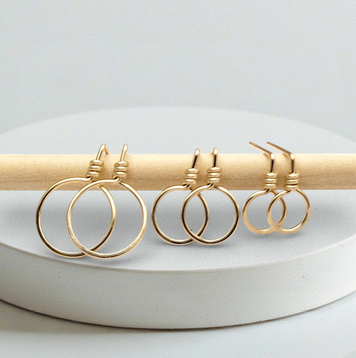 Small gold circle stud earrings from Bijou by SAM, featuring minimalist and elegant jewelry design.