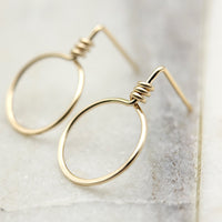 Small gold circle stud earrings from Bijou by SAM, featuring sleek, minimalist design with a polished finish.
