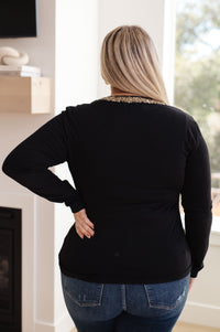 Top de manga larga con cuello en V y forro brillante